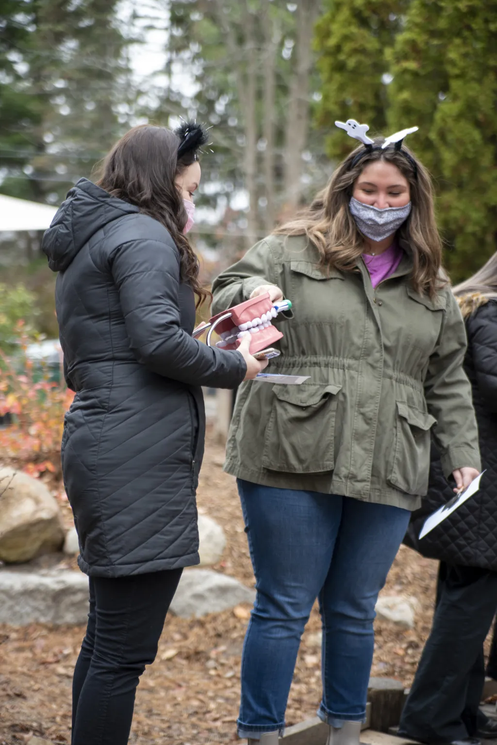 Baylee Flemming and Julia Hamilton illustrate proper teeth-brushing etiquette on props.