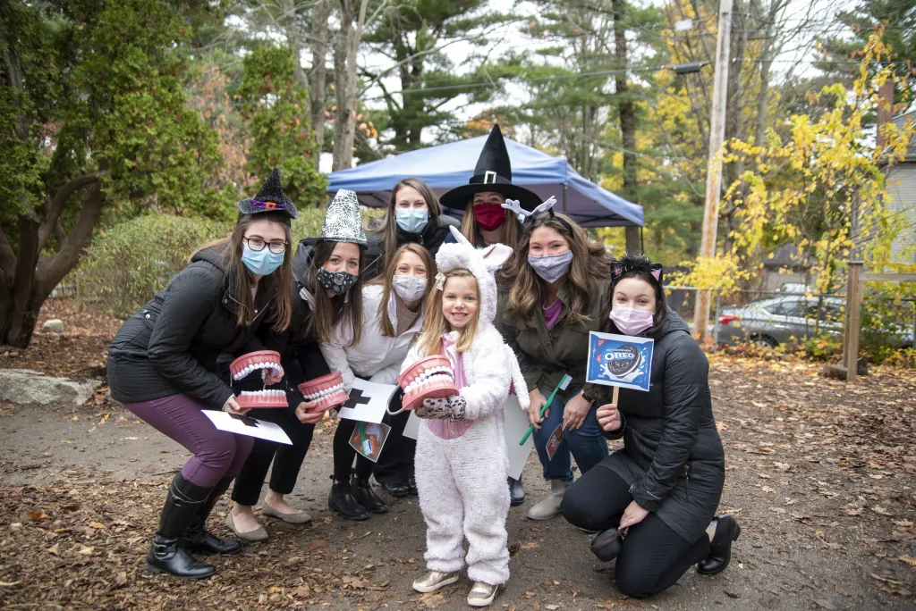 The students gather with Salamon's daughter, Evie.