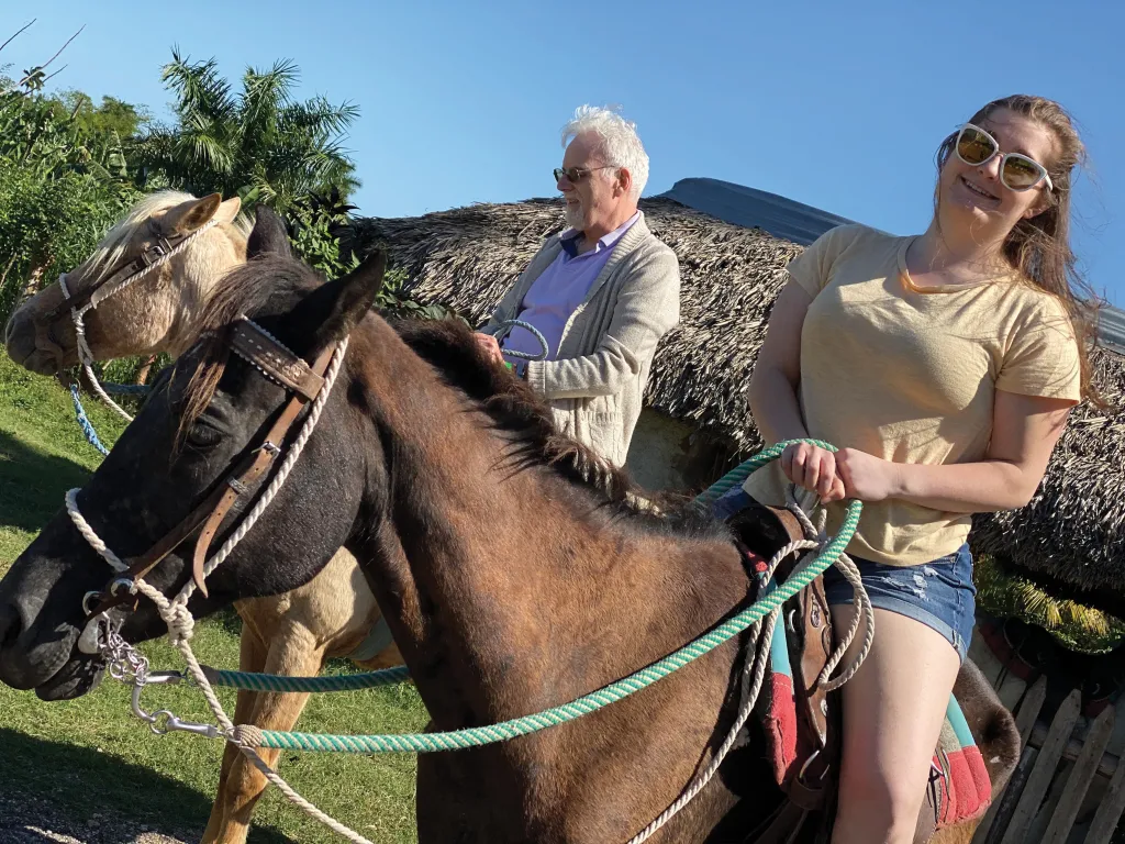 Mariah Berchulski rides a horse in Cuba