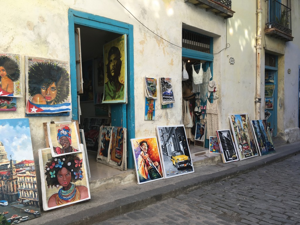 art work for sale on the sidewalk in old havana, cuba