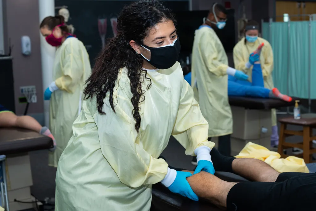 Students practicing in the OMM lab