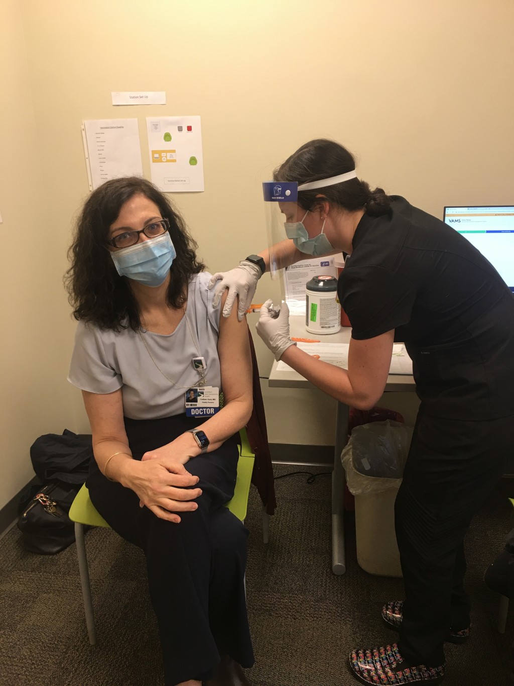Olivia Patsos (D.O., ’22) vaccinates her clinical coordinator, Dr. Colleen Guiry.