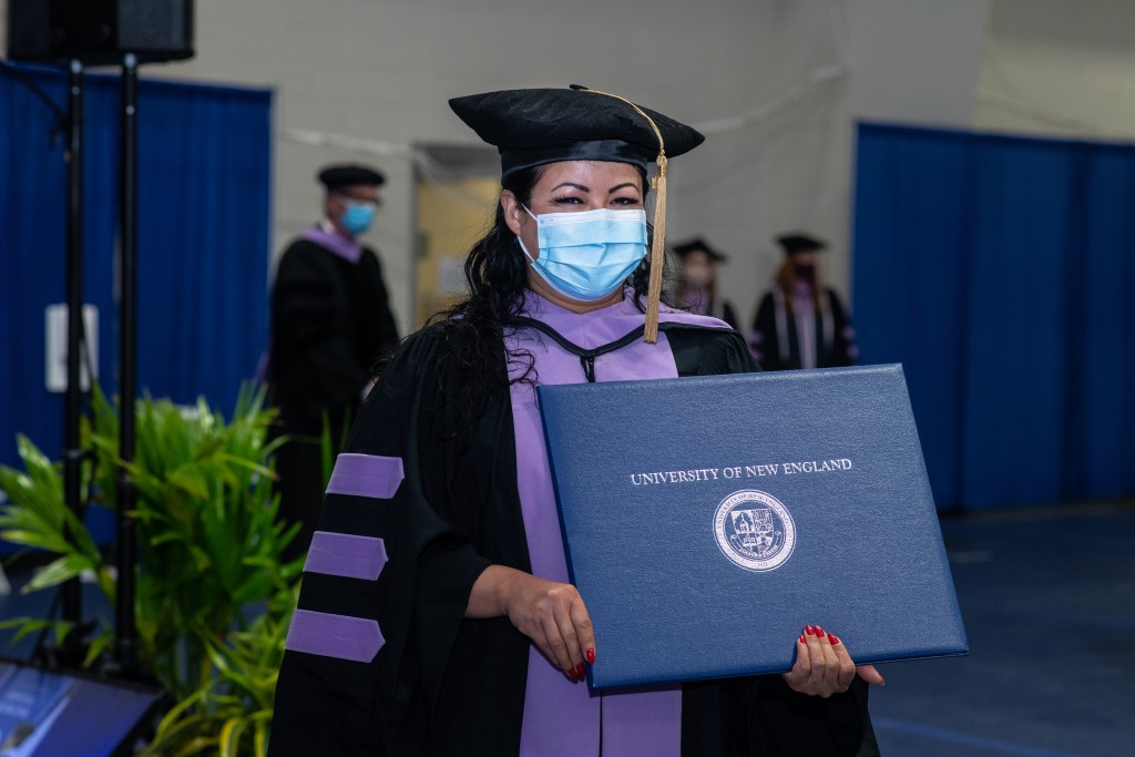 College of Dental Medicine graduate holds diploma