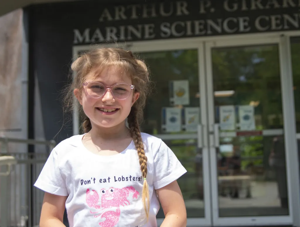 Uliana Cavalier stands in front of the Marine Science Center