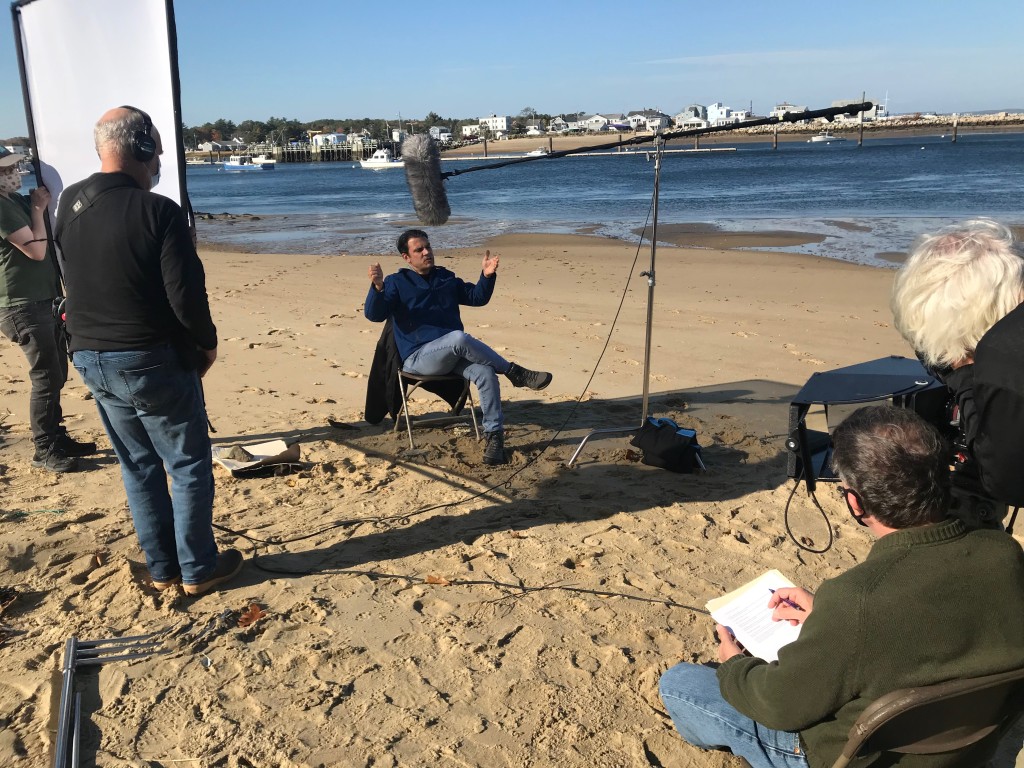 Charles Tilburg being interviewed on beach
