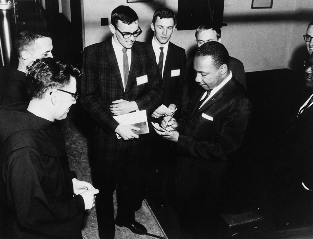 Martin Luther King, Jr. signing autographs