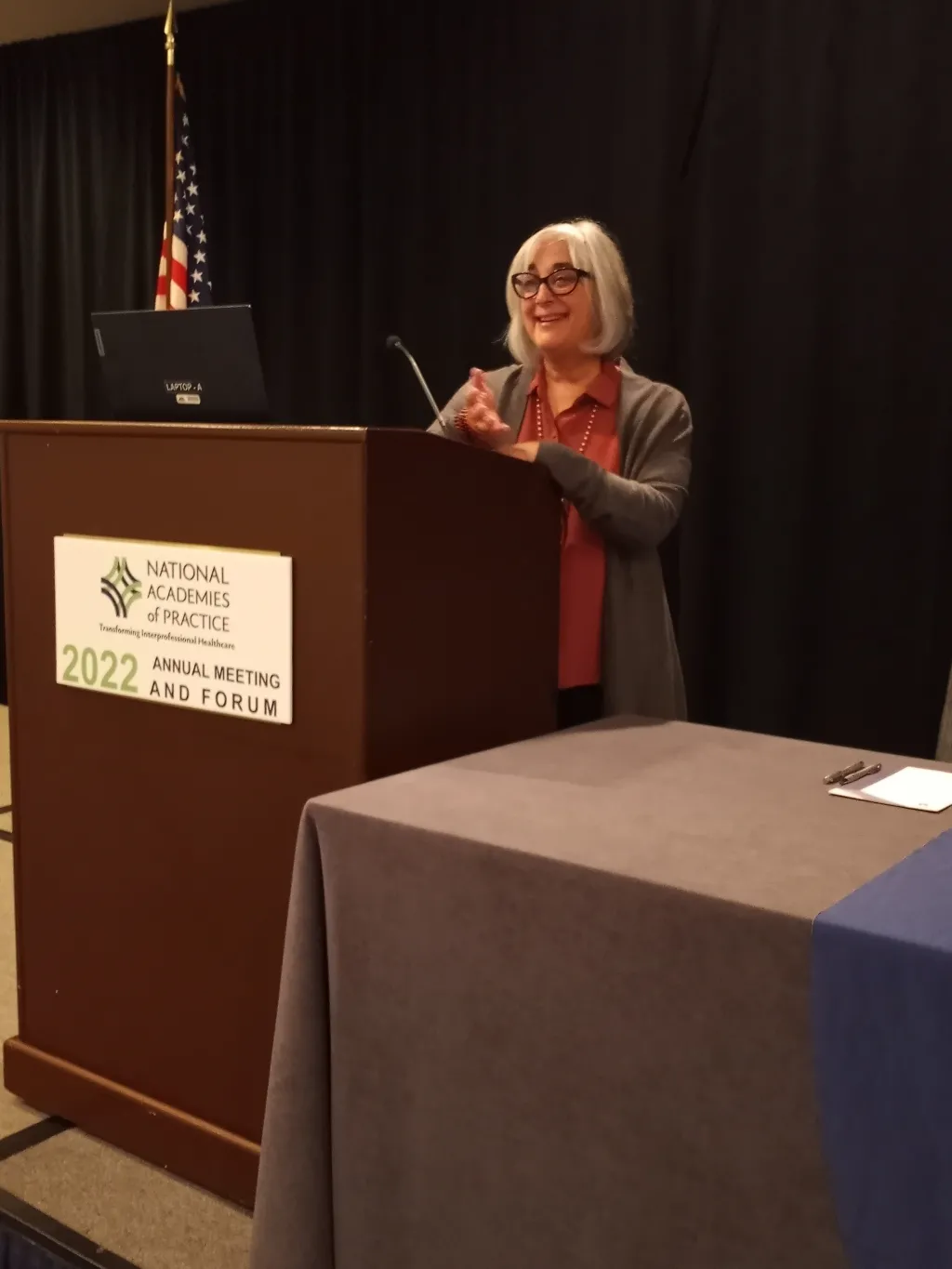 Shelley Cohen Konrad stands at the podium