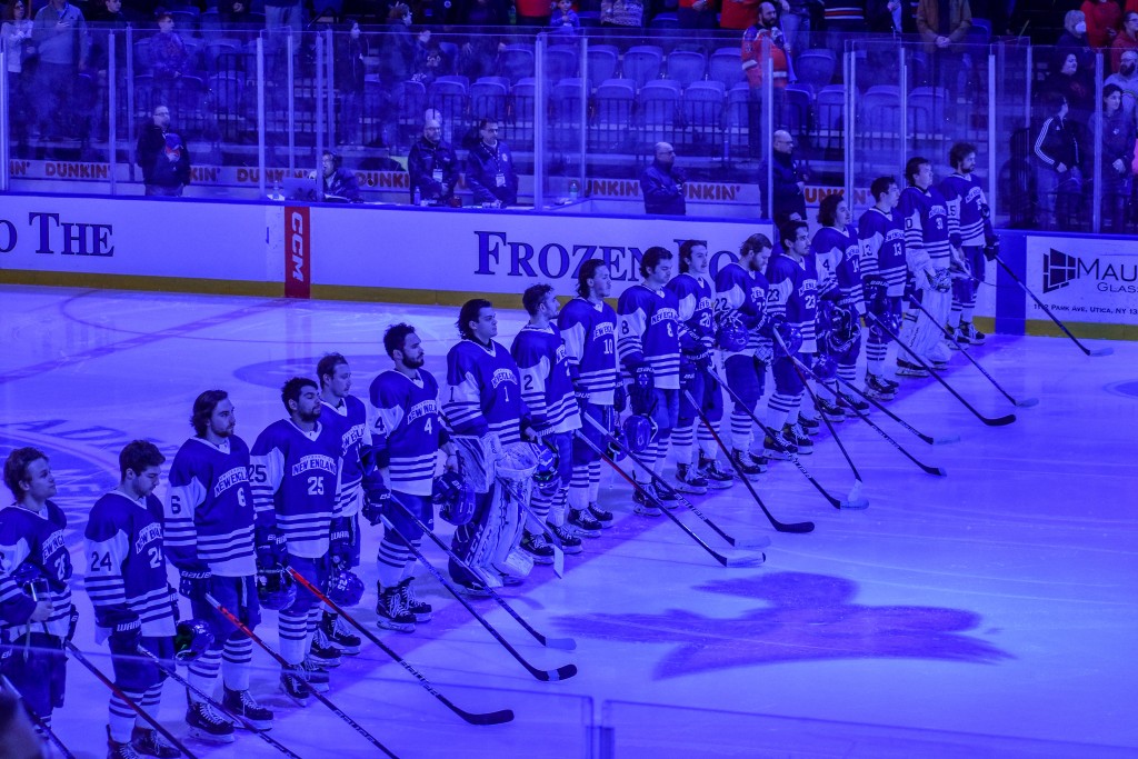 The hockey team lines up at the start of the game
