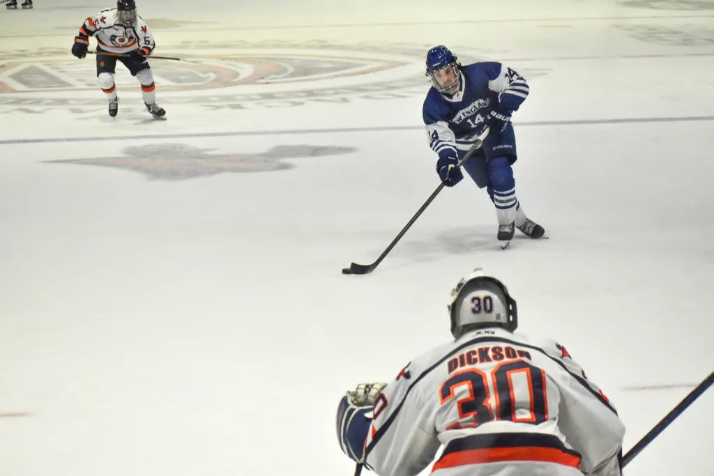 #14 Daniel Winslow carries the puck