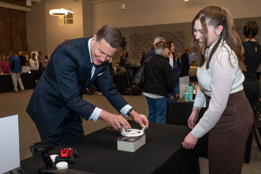 President James Herbert plays with a 3D-printed remote vehicle control