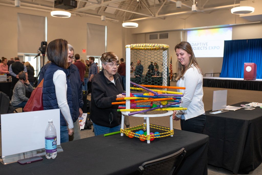 Attendees play with a giant Kerplunk made by Nicole Cochran.