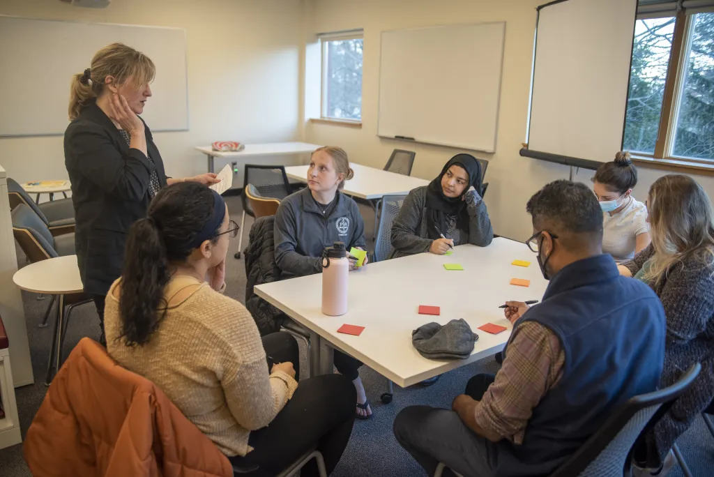 Justine Bassett, director of Innovation at UNE, outlines the processes for the cultural competency roundtable.