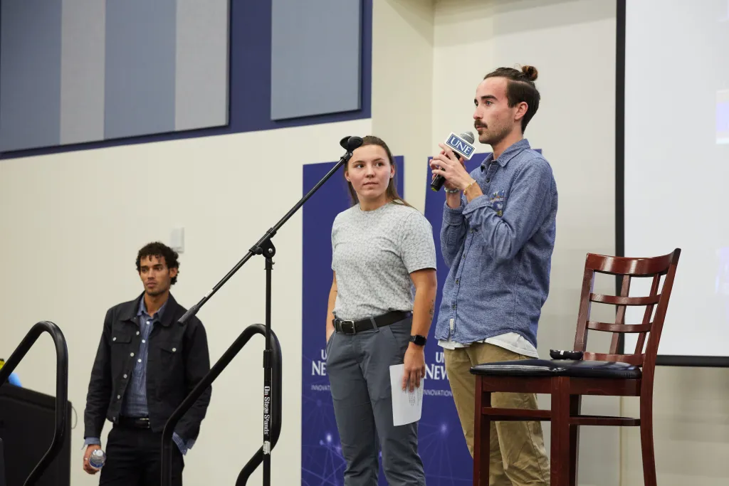 Aiden O'Keefe, a leader of Storming the Change at UNE, addresses the crowd.