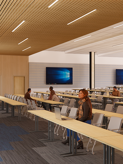 A rendering shows students sitting in a lecture hall in the new COM facility