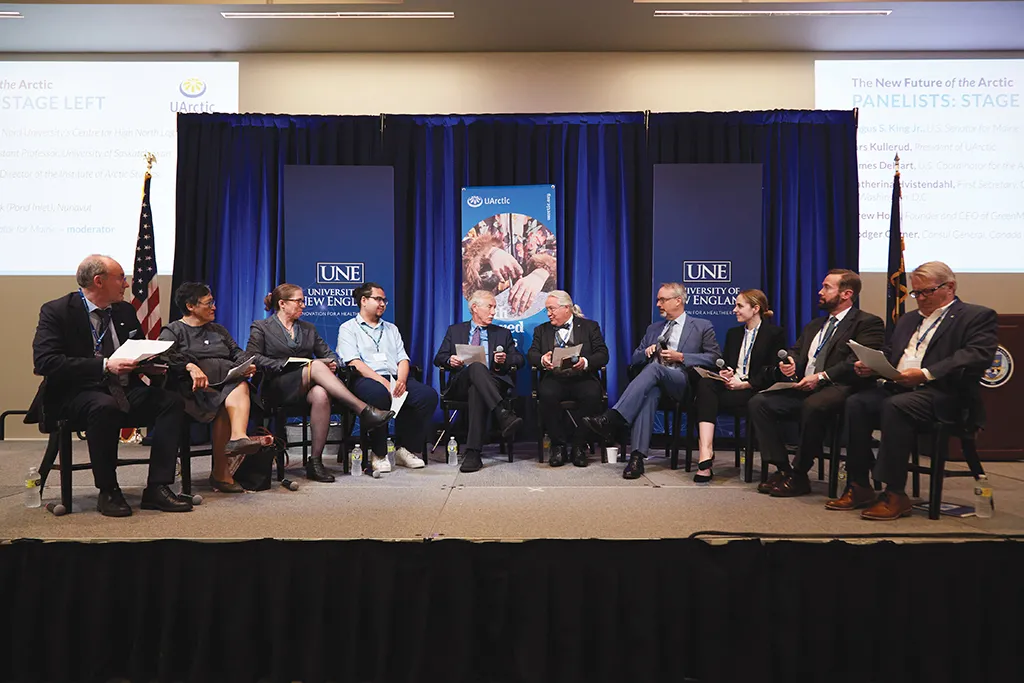 Angus King and others sitting and speaking at the UArctic Assembly