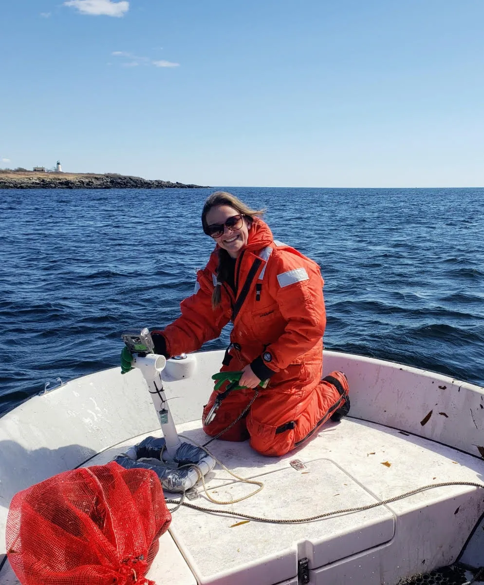 U N E student Emily Schutt on a boat