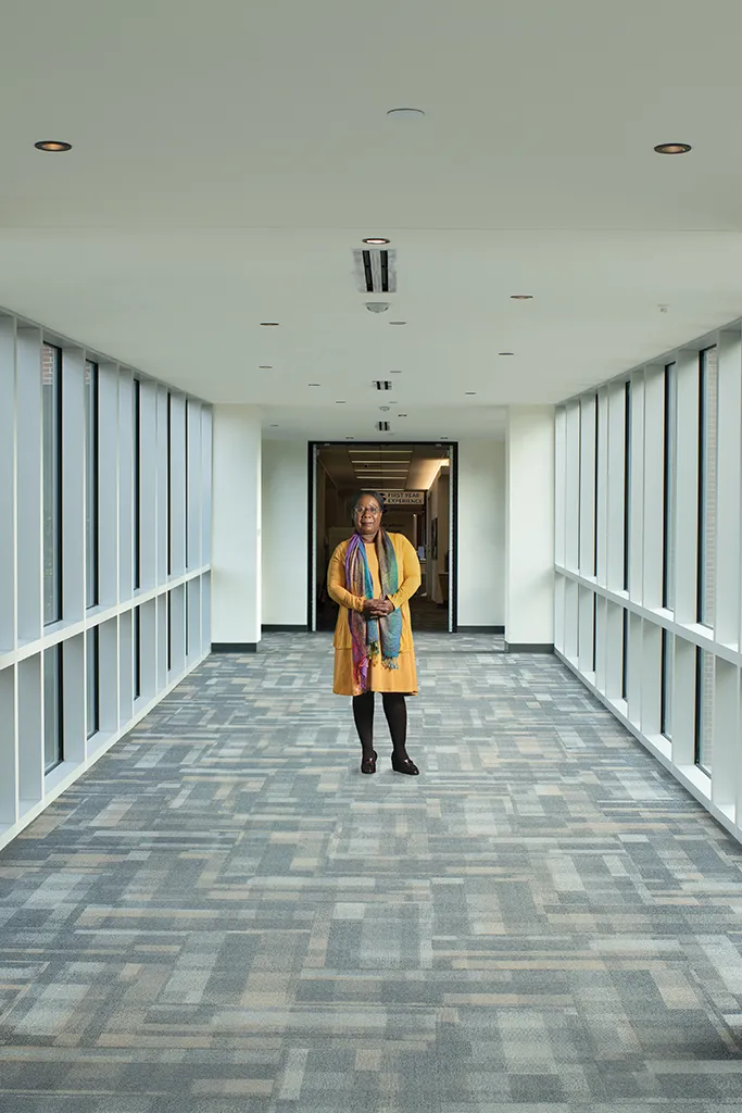Portrait of Carol Ewan Whyte standing in a hallway