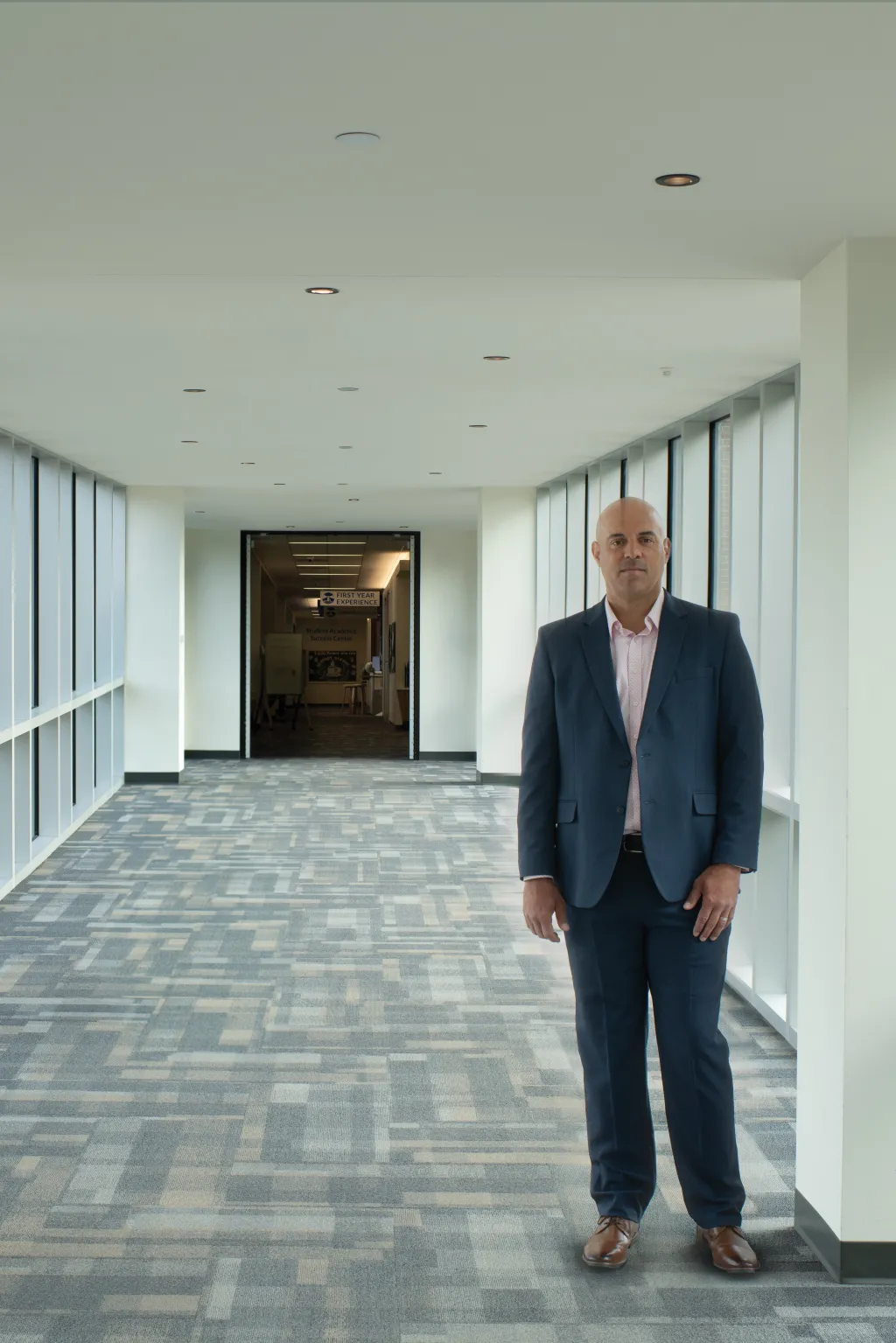 Portrait of Ed Silva standing in a hallway