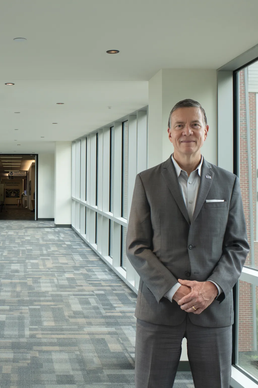 Portrait of President Herbert standing in a hallway