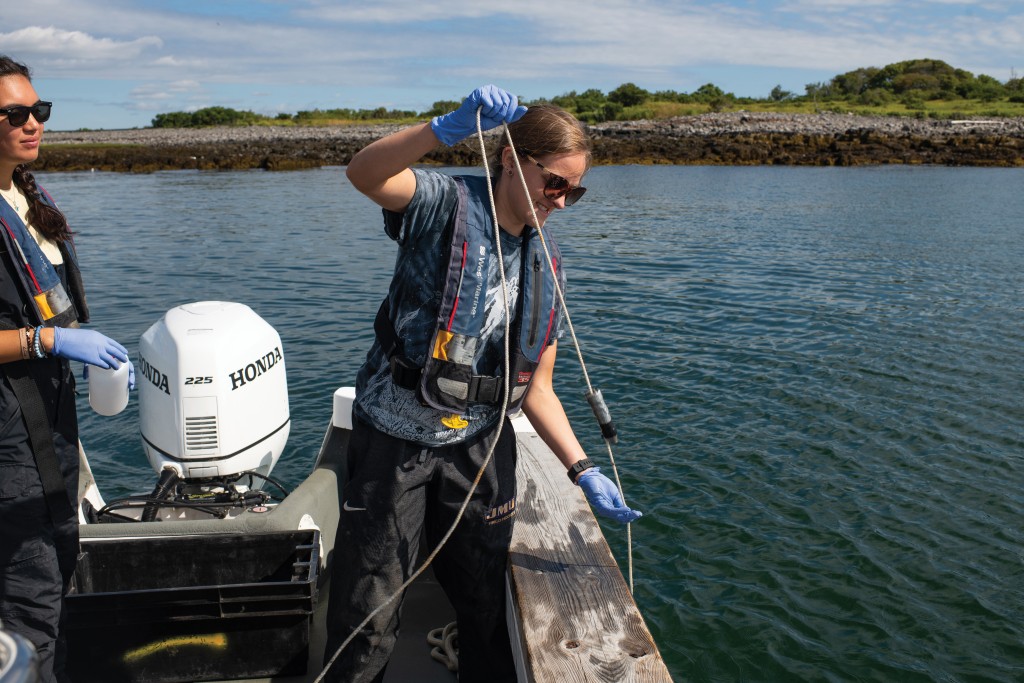 A Marine Sciences student preparing to test ocean water