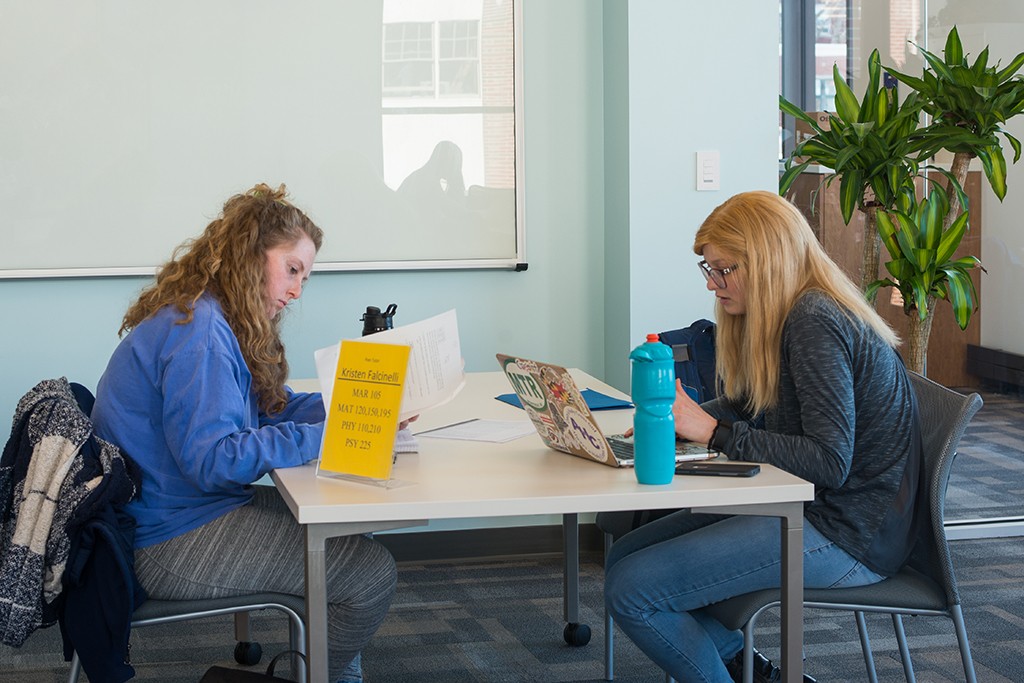 Two students study in the student academic success center