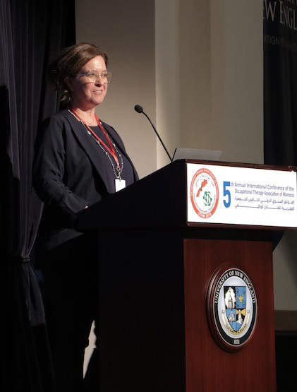 Photo of Tara Paradie speaking at the OT conference in Morocco