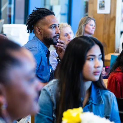 U N E students sitting during the Scholars of Color Breakfast