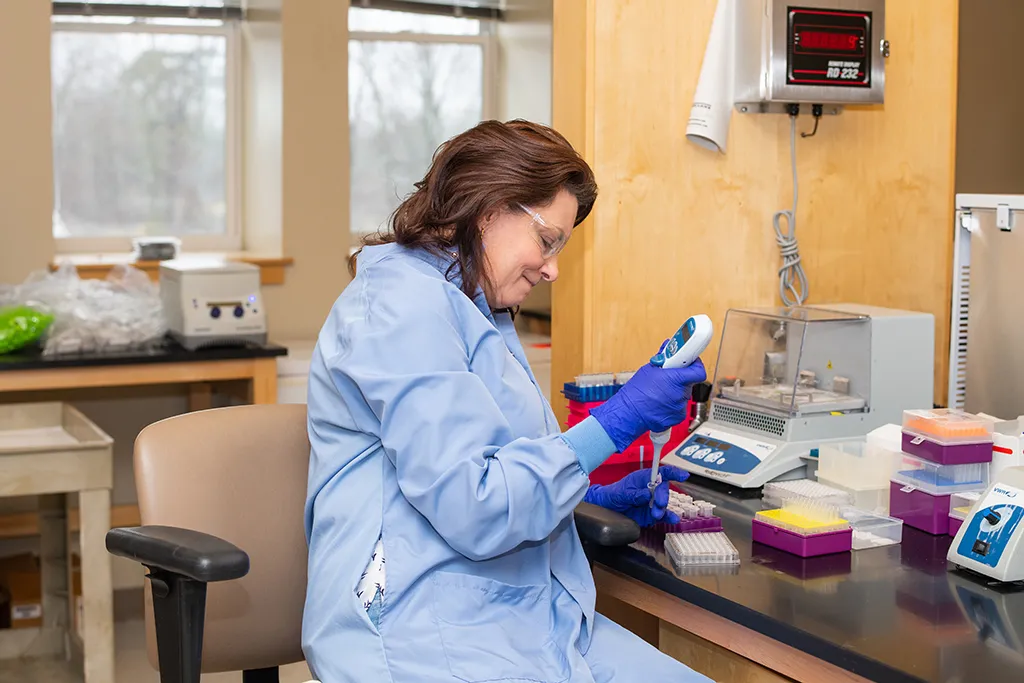 A professor working in a lab setting