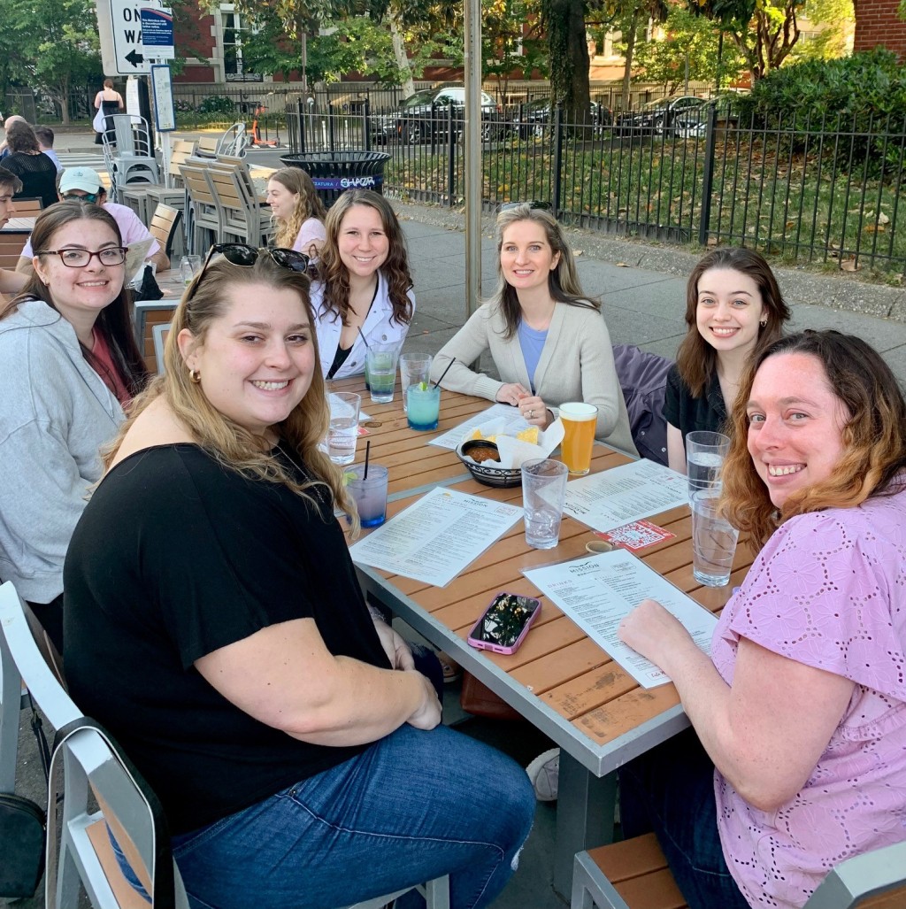 Current and former psychology students gather at a restaurant