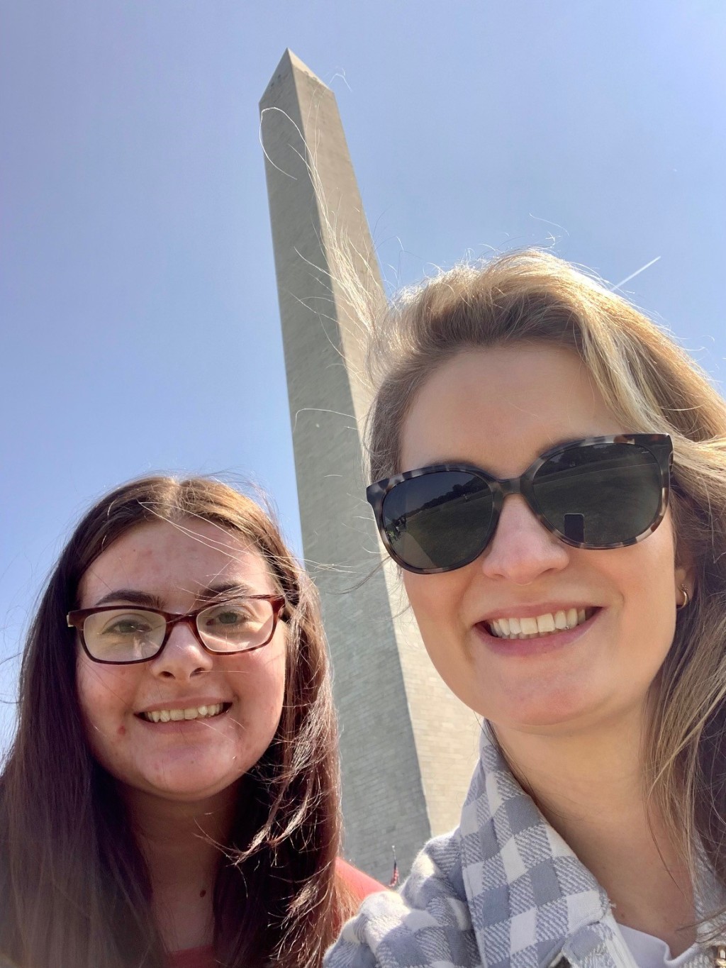 Sarah Gray and Jennifer-Stiegler Balfour pose for a selfie in front of the Washington Monument