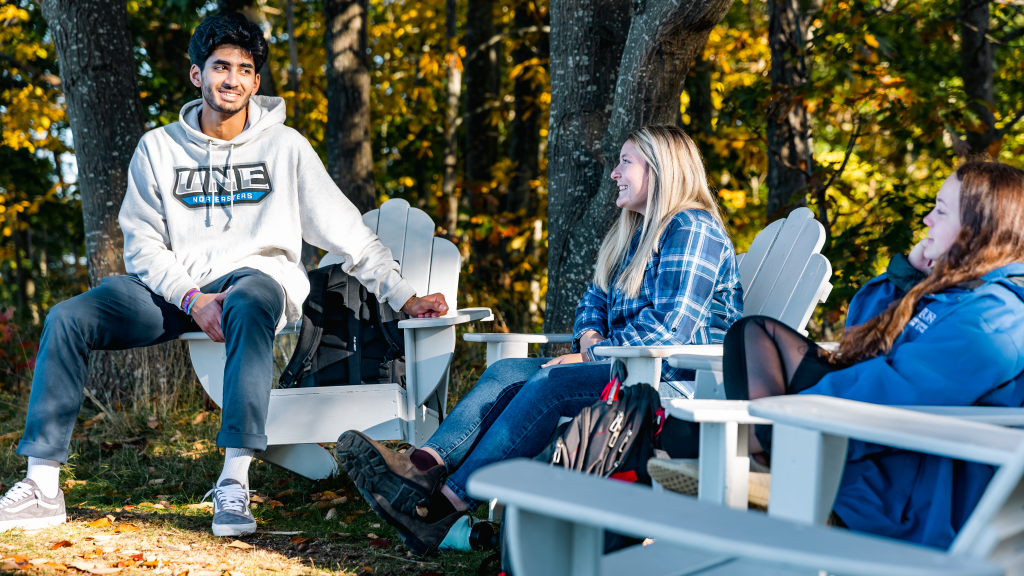 A group of students sit and chat at Jordan Point