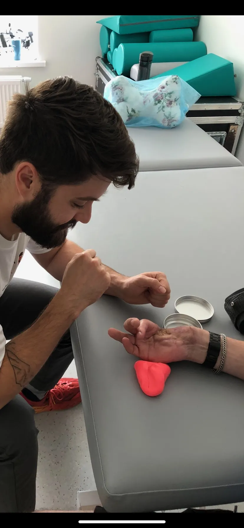 Motley performs OT on a soldier's hand
