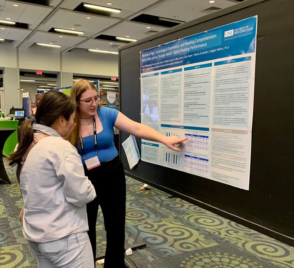 Emily Newborough presents her research to a viewer