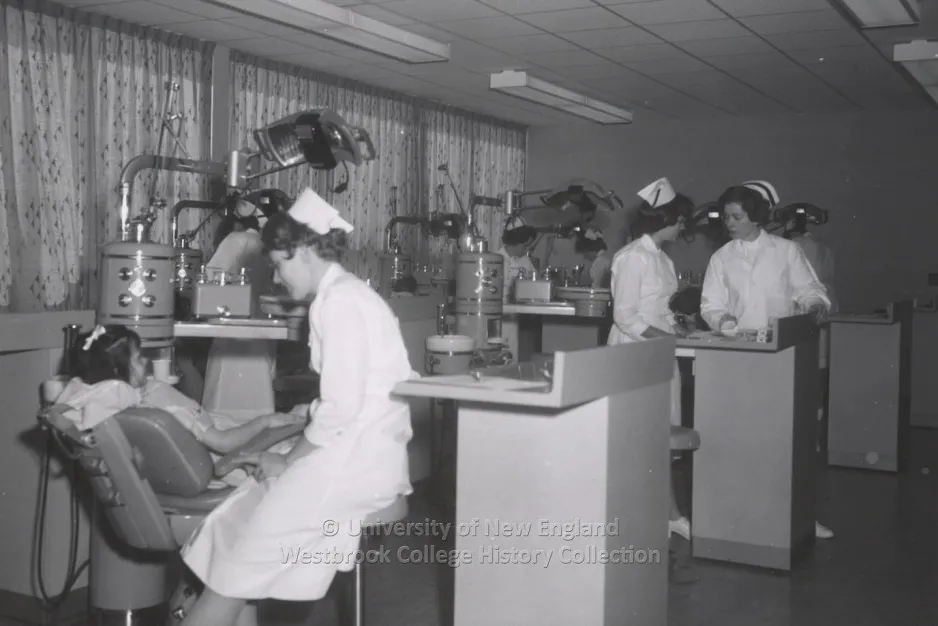 A historical black and white photo of nursing students