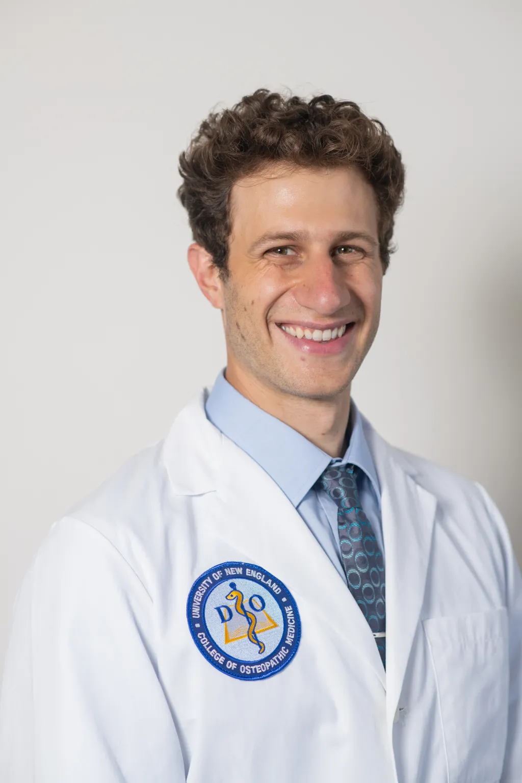 Portrait of Christoph Niederhauser in COM white coat