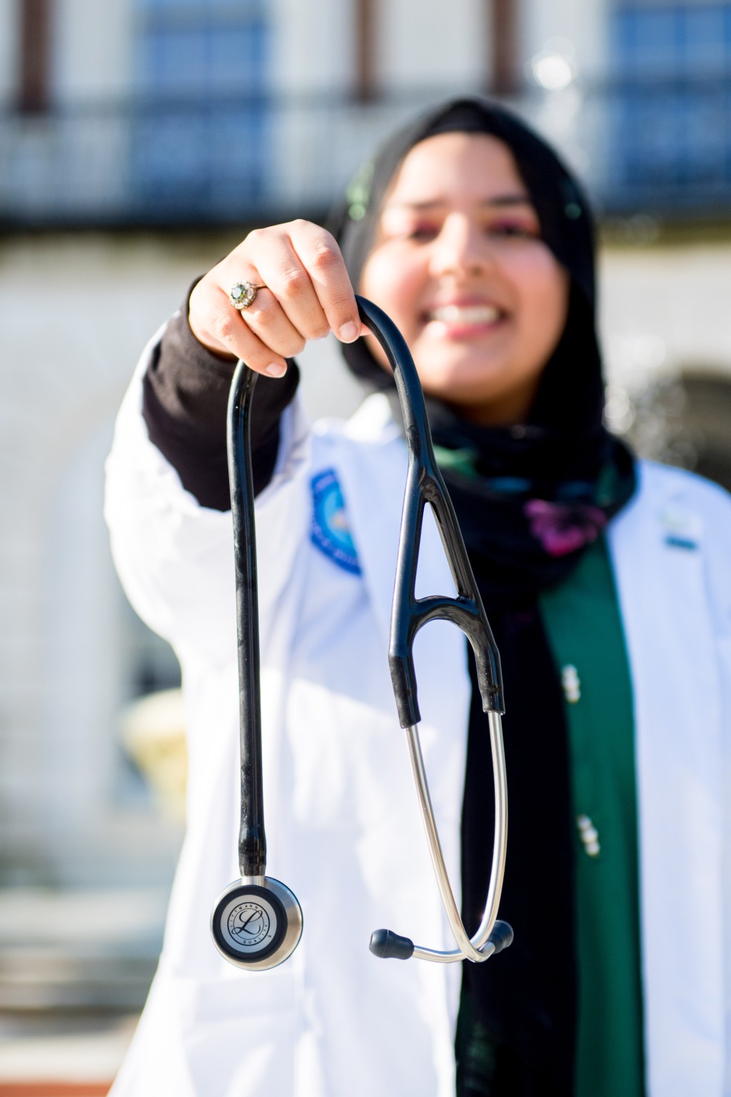 Fajar holds up her stethoscope