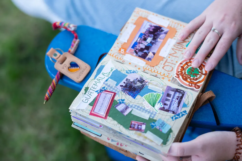 Kiara's scrapbook page for Guatemala with collages, words, and stickers