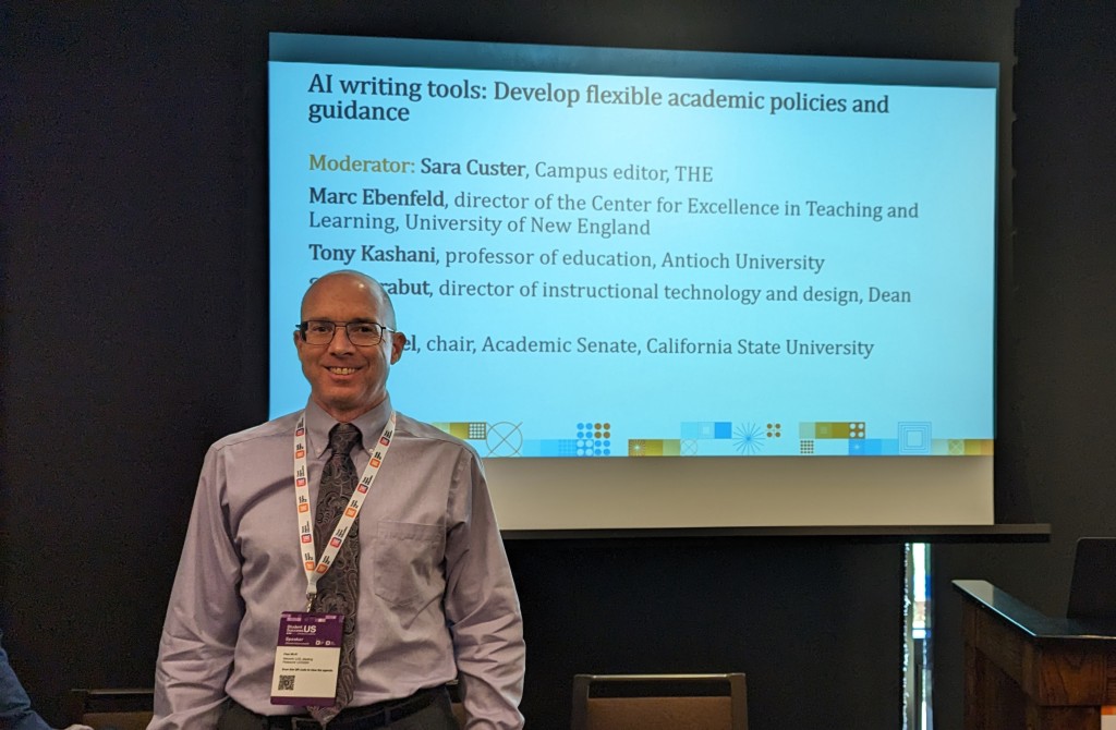 CETL Director Marc Ebenfield stands in front of a presentation screen at the Student Success USA conference in Los Angeles