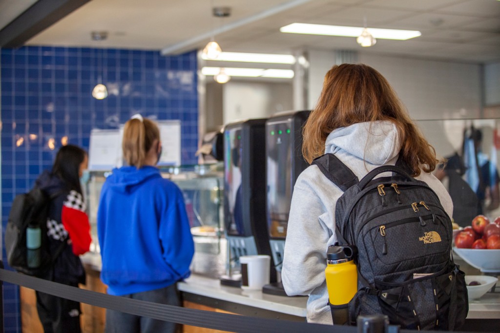 Students lining up to pay at a food counter in the Commons
