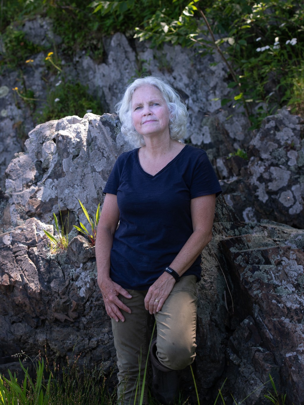 Portrait of Pam Morgan standing against rocks