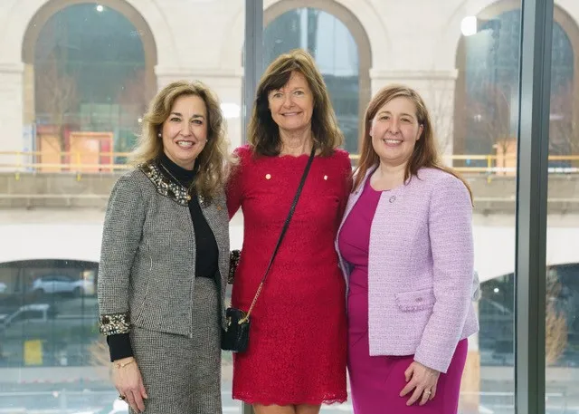 Three educators pose for a photo