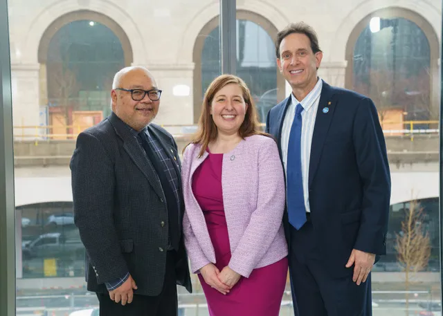 Three dental medicine professors pose for a photo