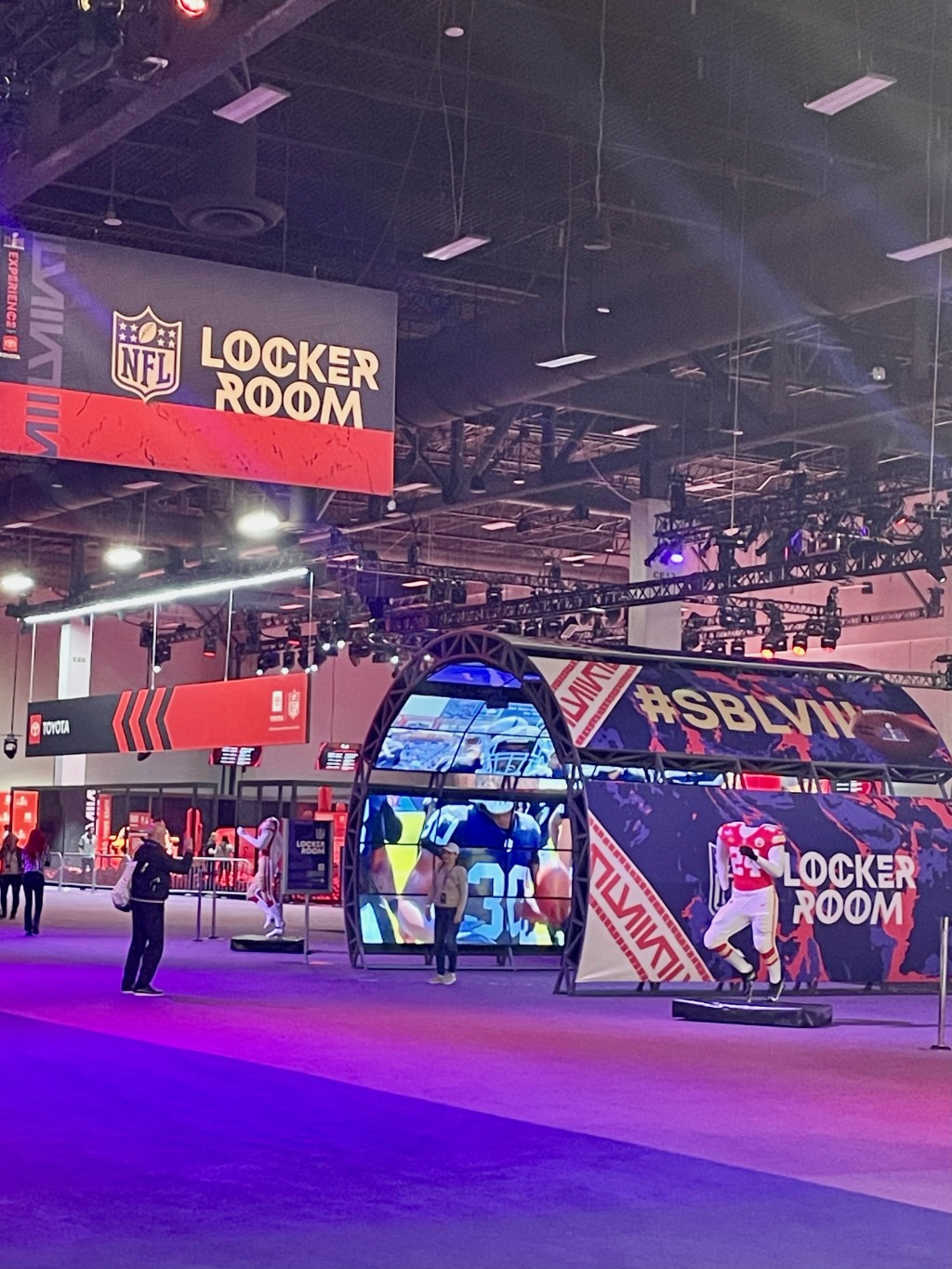 A view inside a large convention space with NFL event spaces