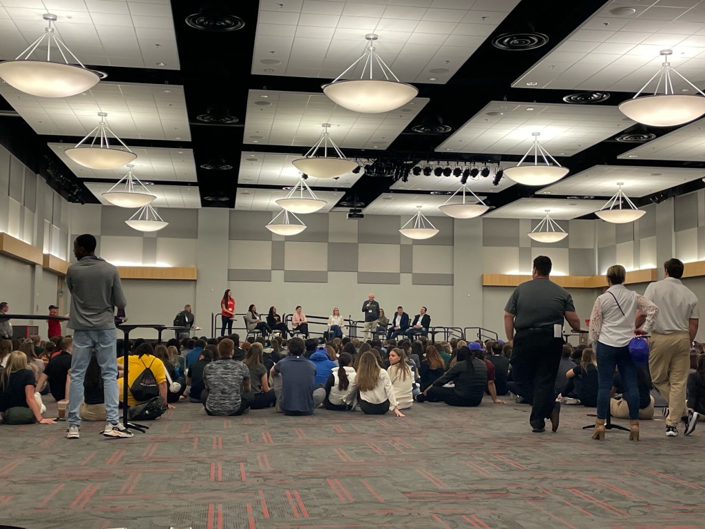 Students gather in a convention space