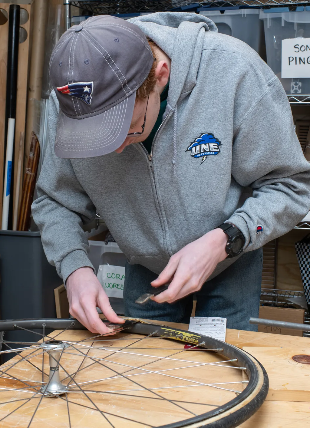 A student assembles a wheel