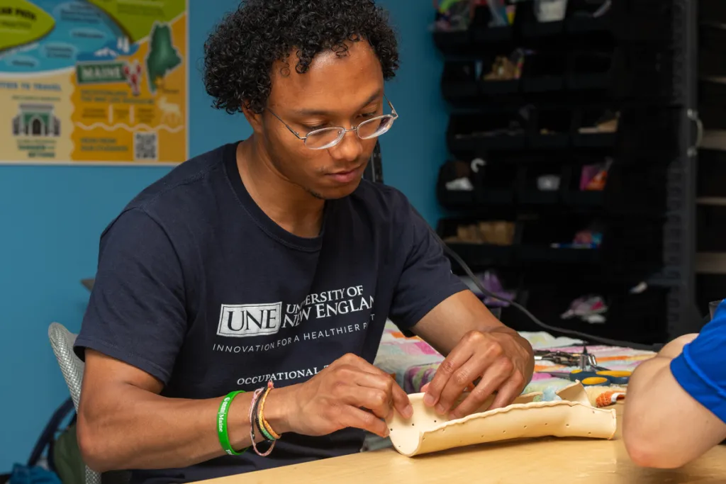 An Occupational Therapy student molds a wrist splint