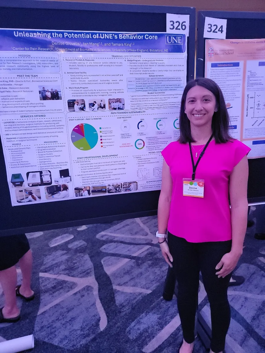 Denise Giuvelis poses in front of her research poster