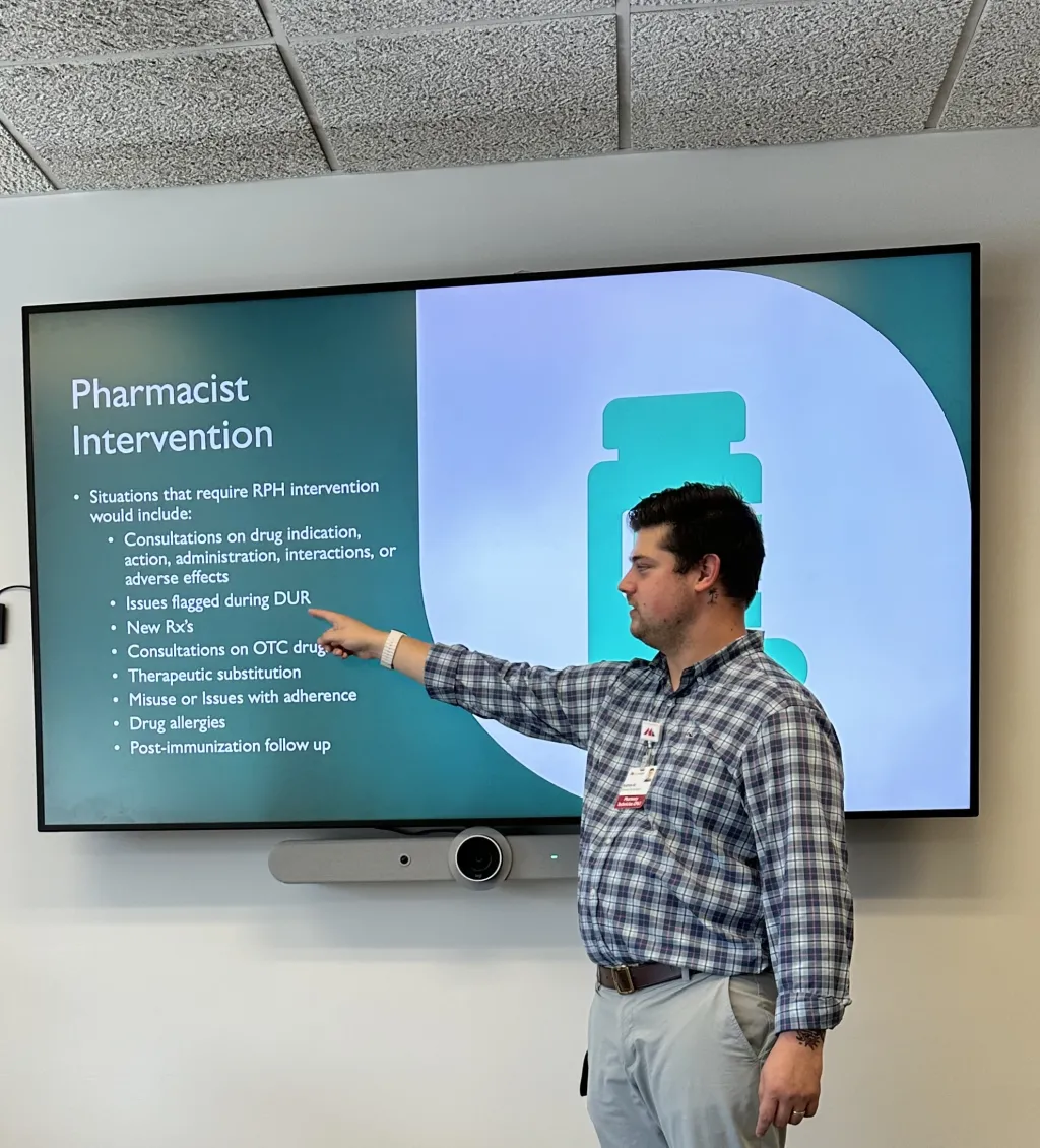 Andrew Marcous points to a TV screen as he gives a presentation at Maine Medical Center