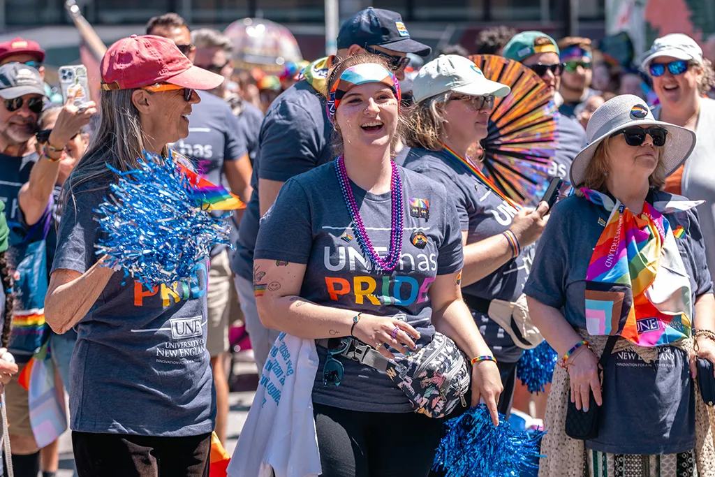 A large group from U N E walk in a Portland Pride Parade
