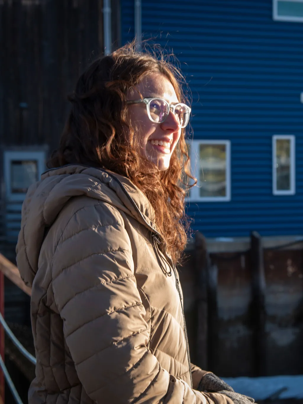 Samantha Ryea smiles while standing along the Portland, Maine waterfront